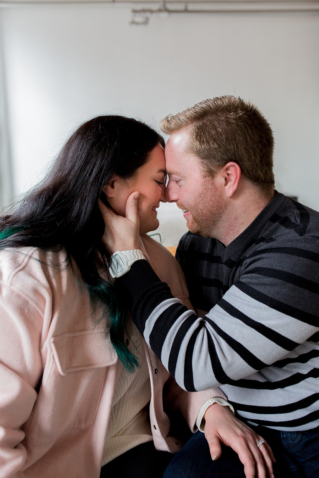 Couple touches foreheads intimately during their Vancouver couple's session in a downtown studio