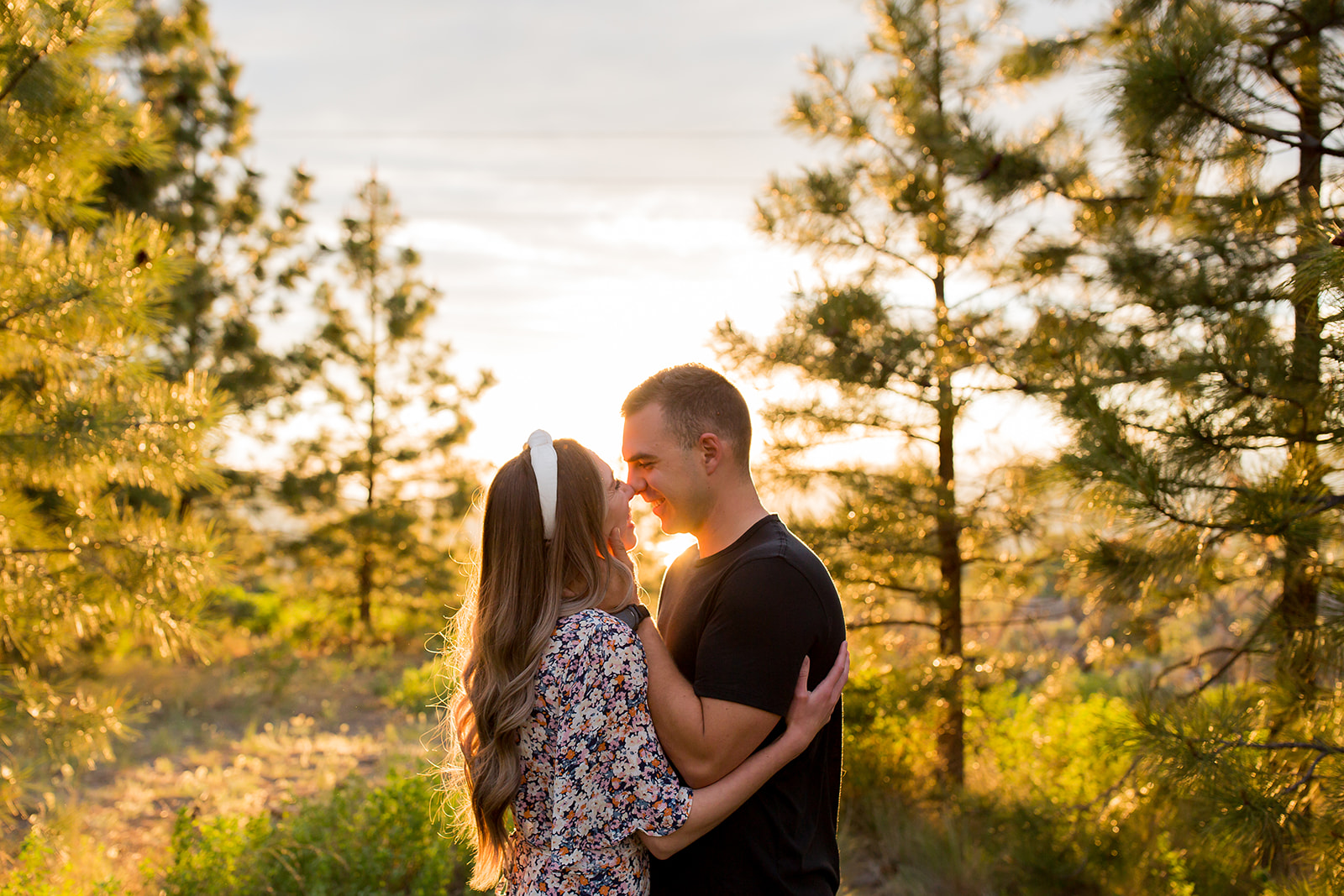 Couple shares a kiss at Rose Hill Park in Kamloops during their engagement session 
