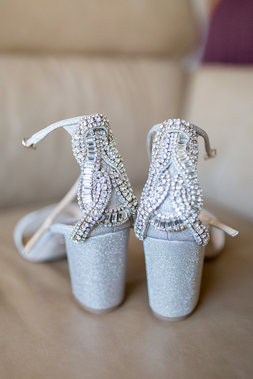Detail shot of a bride's silver sparkly shoes before she puts them on for her wedding at Monte Creek Winery in BC