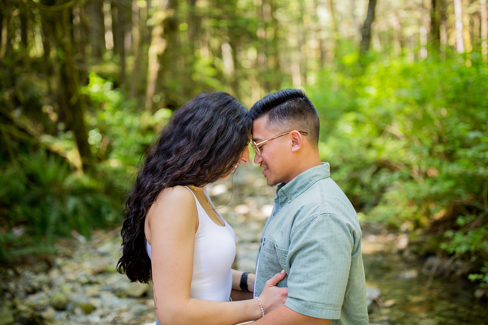 young couple touches foreheads intimately at Golden Ears Provincial Park during their couple's photo session