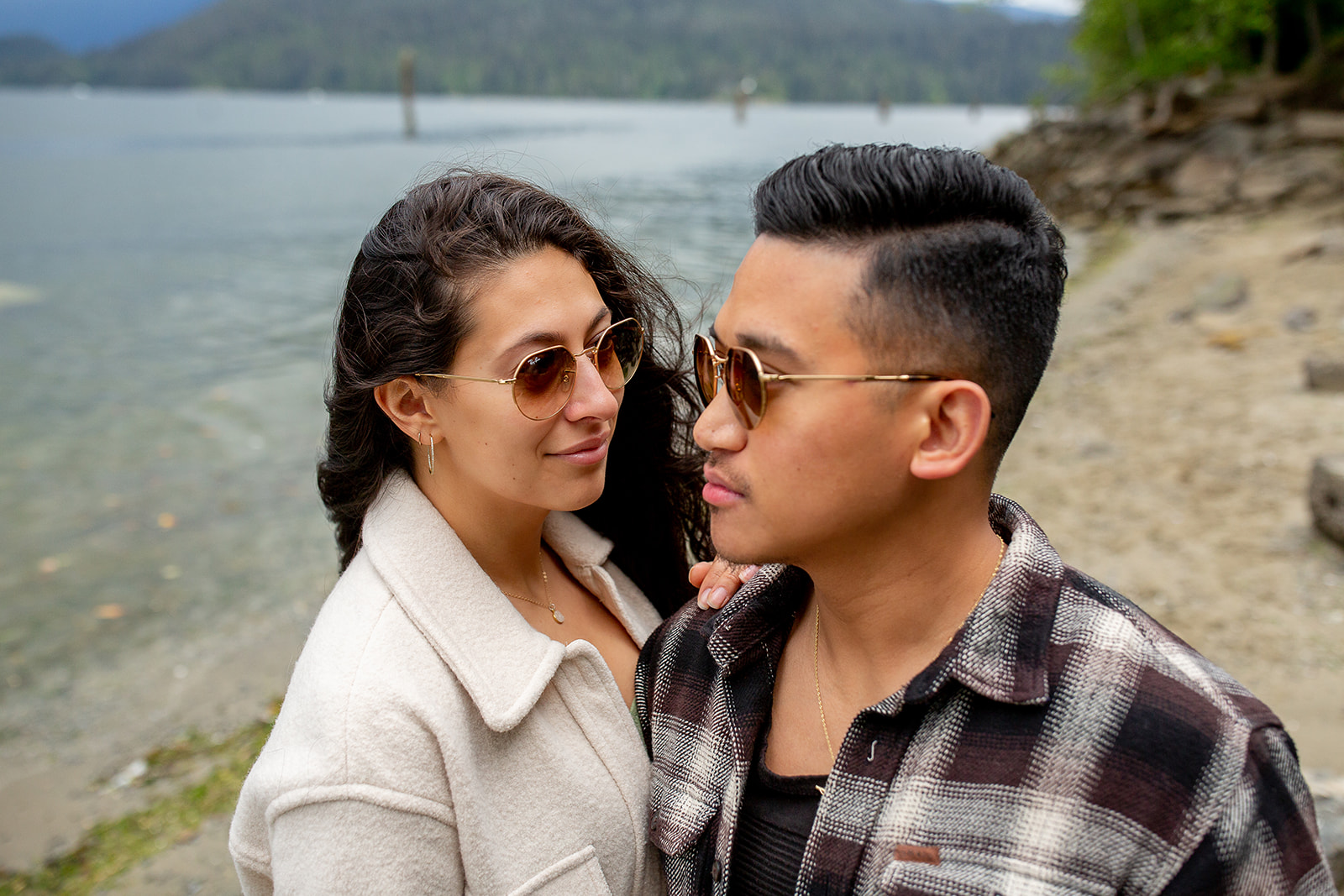 Couple with wearing matching brown aviator sunglasses at their Barnet Marine Park Session during their engagement photoshoot