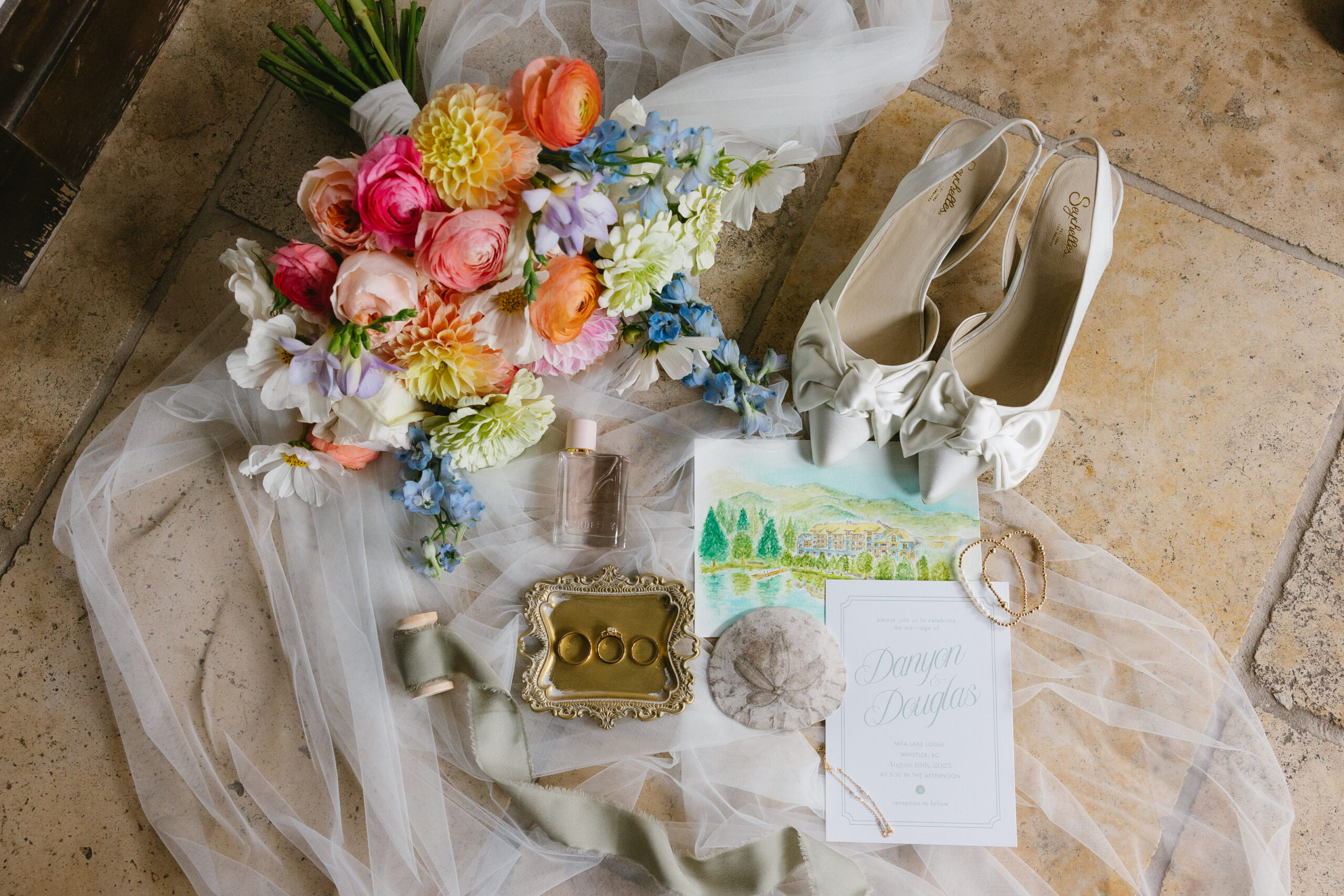 wedding stationery set up with florals and wedding invites at the fairmont chateau whistler
